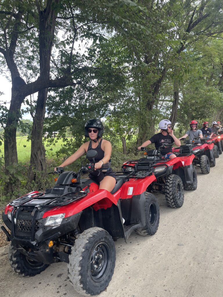 ATVs splashing across a river on a Guanacaste off-road tour