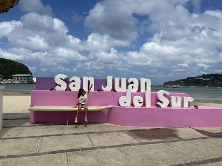 Local artist painting a colorful canvas on a Nicaragua day tour