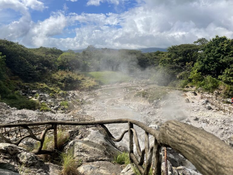 Guest relaxing in a natural thermal pool on a Guanacaste hot springs tour